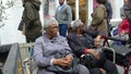 Two old black Caribbean ladies seated on a bench talking. London