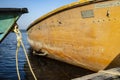 Two old boats tied with a rope to the pier Royalty Free Stock Photo