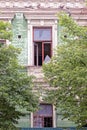 two old brown windows with broken glass on the brick wall Royalty Free Stock Photo