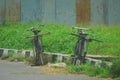 Two old bycycle on the road at the rice field