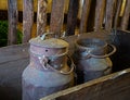 Two old cans in truck in the barn