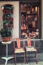 Two old chairs in front of the window of a shop in the old city of Nice Royalty Free Stock Photo