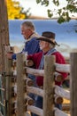 Two Old Cowboys Standing by Rail Fence Royalty Free Stock Photo