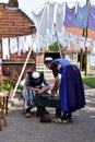 Two old dutch women preparing for a tea time