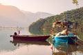 Two old fishing boats blue and red colors stand at the pier Royalty Free Stock Photo