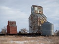 Two Old Grain Elevators along Railroad Tracks in Zurich, Montana