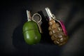 Two old hand grenades on a dark background Royalty Free Stock Photo