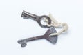 Two old keys tied with a white rope. Keys lie on a white background. Royalty Free Stock Photo