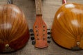 Two old mandolins on a background of rough burlap texture. Royalty Free Stock Photo