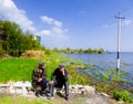 Two old men chatting near Erhai