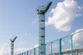 Two old metal a bit rusty watch towers against light sky Royalty Free Stock Photo