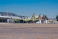 Two old military airplanes parked in the air strip waiting to be repaired