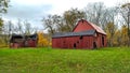 Two Old Red Barns in a green field Royalty Free Stock Photo