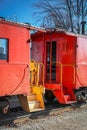 Two old red train cars connected