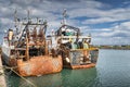 Two old and rusty fishing boats moored in Howth harbour, Dublin, Ireland Royalty Free Stock Photo