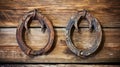 Two old rusty horseshoes on vintage wooden Royalty Free Stock Photo