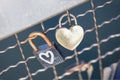 Two old rusty padlocks with heart on the bridge Royalty Free Stock Photo