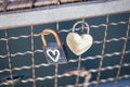 Two old rusty padlocks with heart on the bridge Royalty Free Stock Photo