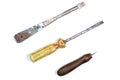 Two old screwdrivers and an awl on a white background Royalty Free Stock Photo