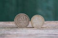 old silver coins stand on a gray table Royalty Free Stock Photo