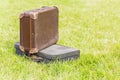 Two old suitcase on grass Royalty Free Stock Photo