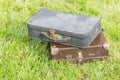 Two old suitcase on grass Royalty Free Stock Photo