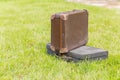 Two old suitcase on grass Royalty Free Stock Photo