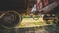 Two old rusty train cars connected with rusty coupler on railway Royalty Free Stock Photo