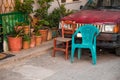 Two old vintage chairs and flower pots calm village setting view Royalty Free Stock Photo