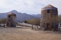 Two old windmills built in stone in Elounda, Eastern Crete Greece Royalty Free Stock Photo