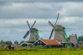 Two Old Windmills on a Cloudy Day Royalty Free Stock Photo