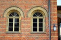 Two old windows with bricks and arch Royalty Free Stock Photo