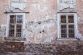 Two old windows with lattice in vintage wall Royalty Free Stock Photo