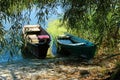 Two old wooden boats on the river bank. Travel, landscapes concept. Royalty Free Stock Photo