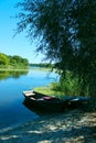 Two old wooden boats on the river bank. Travel, landscapes concept. Royalty Free Stock Photo