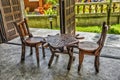 Two old wooden chairs and a table Royalty Free Stock Photo