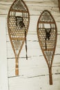 two old wooden snowshoes on wall