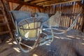 Two old wooden vintage sleighs or sleds in an old restored barn Royalty Free Stock Photo