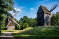Two old wooden windmills in an open-air museum The Opole Village, Poland Royalty Free Stock Photo