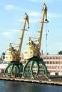 Two old yellow harbor crane Royalty Free Stock Photo