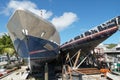 Two older yachts stored on workshops near marina are ready for repair in harbor of Philipsburg in Caribbean Island.