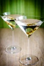 Two olive martini cocktails
