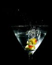 Two Olives Splashing into Martini Glass Royalty Free Stock Photo