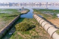 Two open air sewer pipes draining to the Seixal Bay