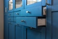 Two open blue kitchen drawers in modern interior. Smart storage. Royalty Free Stock Photo
