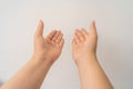 Two open empty female hands with palms up, holding something, isolated on white background Royalty Free Stock Photo