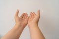 Two open empty female hands with palms up, holding something, isolated on white background Royalty Free Stock Photo