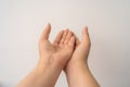 Two open empty female hands with palms up, holding something, isolated on white background Royalty Free Stock Photo