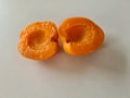 Two open halves of fresh orange apricot Royalty Free Stock Photo