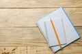 Two open notebook and pencil on natural wooden table. top view. office tools Royalty Free Stock Photo